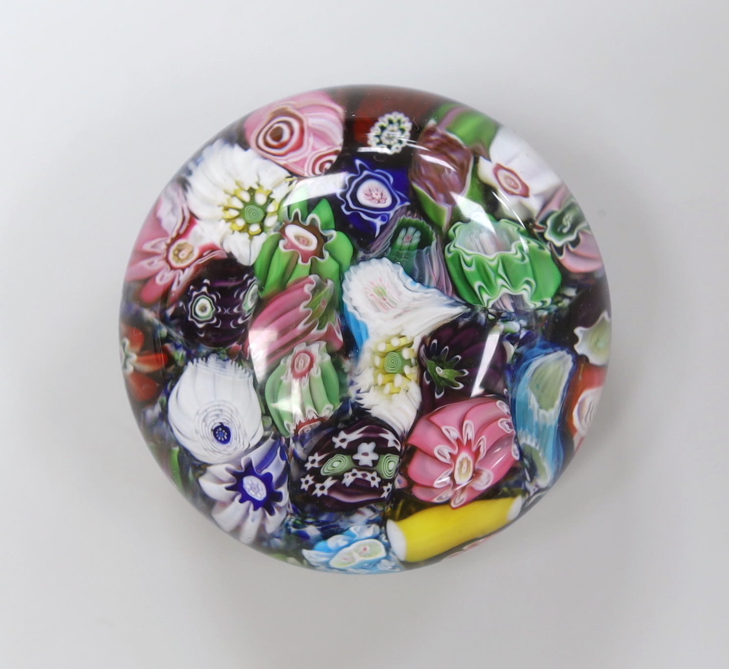 A Clichy scrambled cane paperweight, 5cm diameter